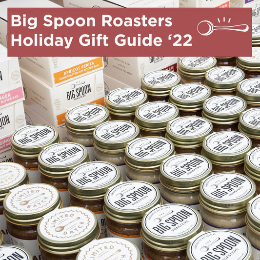 Many Big Spoon Roasters nut butter jars lined up in front of Big Spoon Roasters nut butter bars.