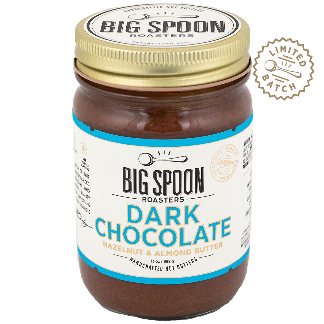 Jar of Big Spoon Roasters Dark Chocolate Hazelnut & Almond Butter with a gold lid on a white background.