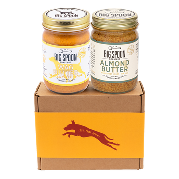 Jar of Vanilla Tater Wag Butter and a jar of Almond Butter with Wildflower Honey on top of a gift box