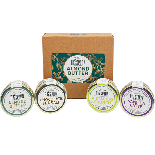 Collection of Big Spoon Almond Butter containers with a branded box on a white background