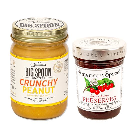 One jar of peanut butter from Big Spoon Roasters and one jar of sour cherry preserves from American Spoon on white background