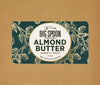 Big Spoon Roasters Almond Butter variety pack label on a brown background