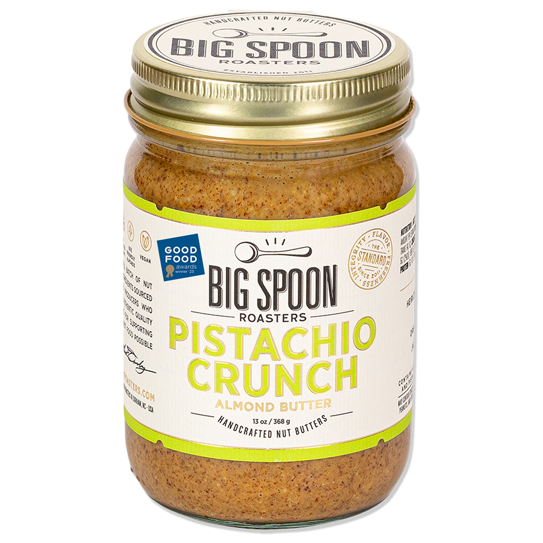 Jar of Pistachio Crunch Almond Butter on white background