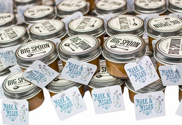 Jars with 'Big Spoon' branding and personalized labels on a white background