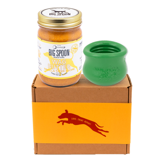 Jar of Vanilla Tater Wag Butter and a green West Paw Toppl toy on top of a gift box