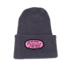 Gray beanie with a pink patch embroidered with the words NUT BUTTER ACTIVIST | BIG SPOON ROASTERS