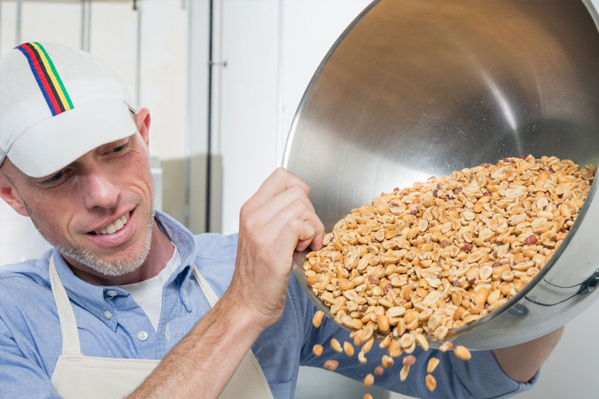 Big Spoon co-founder Mark Overbay pouring peanuts.