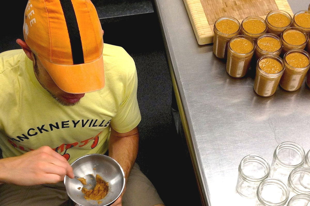 Mark Overbay filling some of the first Big Spoon Roasters nut butter jars
