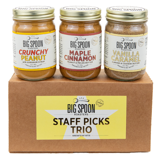 Staff Picks Nut Butter Trio box with three jars—Crunchy Peanut Butter, Maple Cinnamon Peanut & Pecan Butter, and Vanilla Caramel Almond & Cashew Butter—atop.