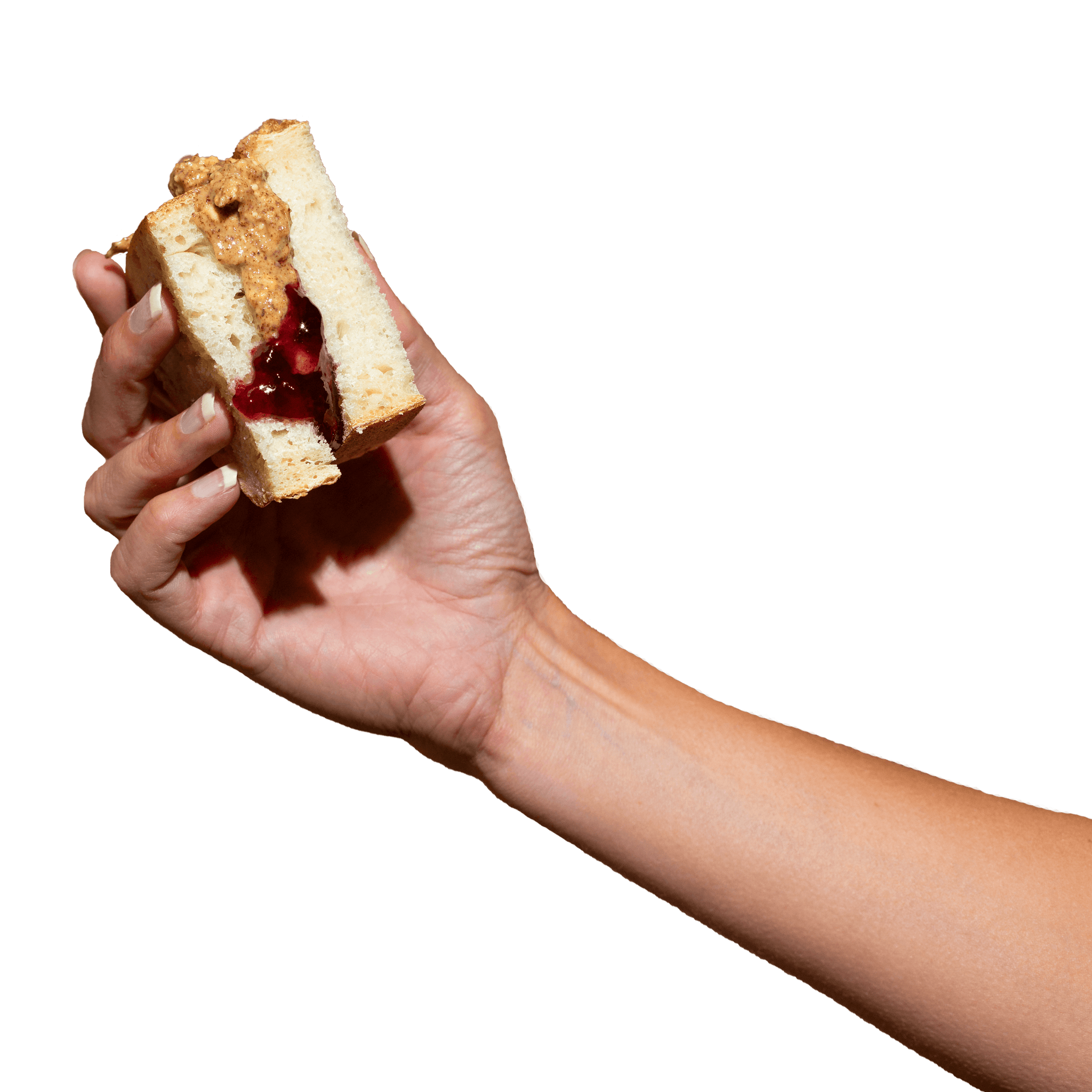 Hand holding AB&J sandwich